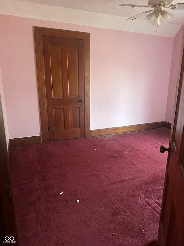 carpeted empty room with ceiling fan