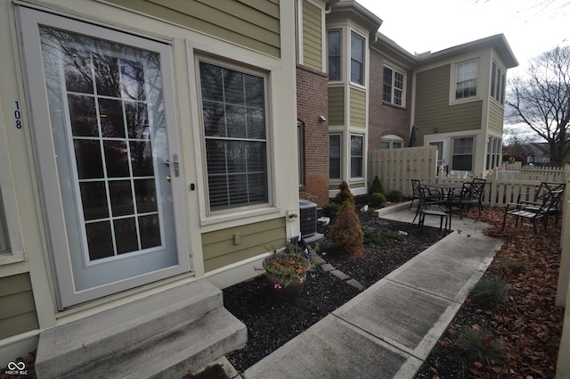 exterior space with cooling unit and a patio