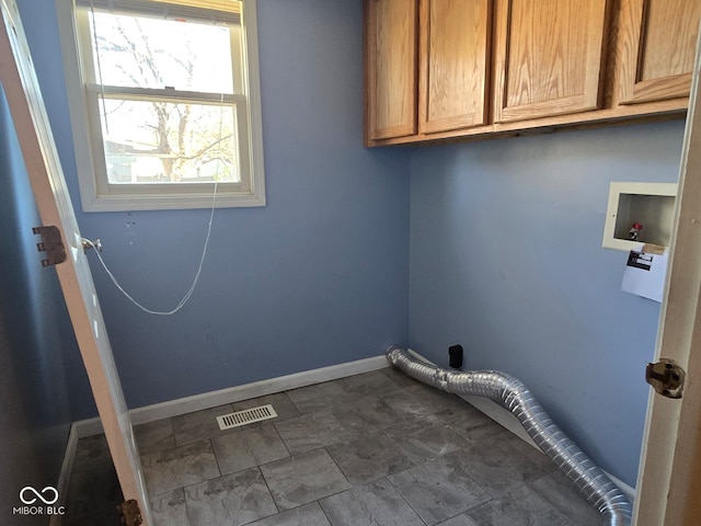 clothes washing area featuring cabinets and washer hookup