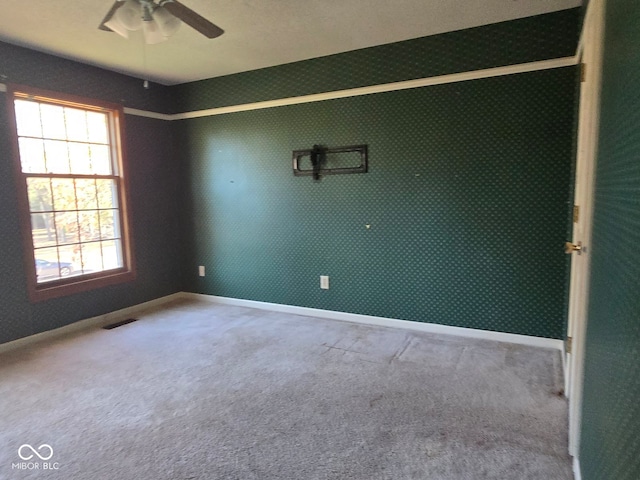 carpeted empty room with ceiling fan