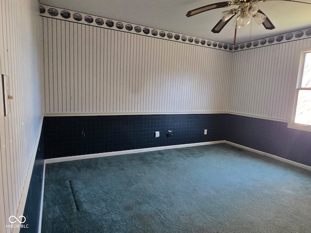 carpeted empty room with ceiling fan