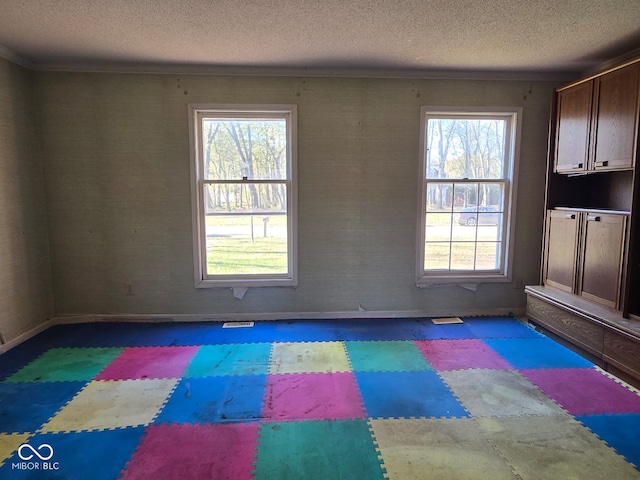 exercise area with a textured ceiling