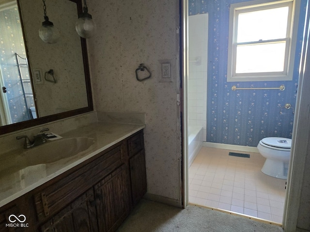 full bathroom featuring tile patterned floors, shower / bathing tub combination, vanity, and toilet