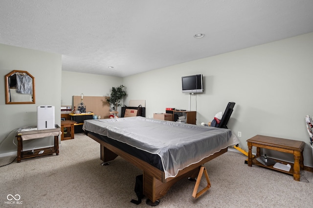 game room featuring carpet floors, a textured ceiling, and billiards