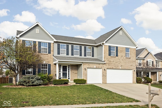 view of front of home with a garage and a front lawn