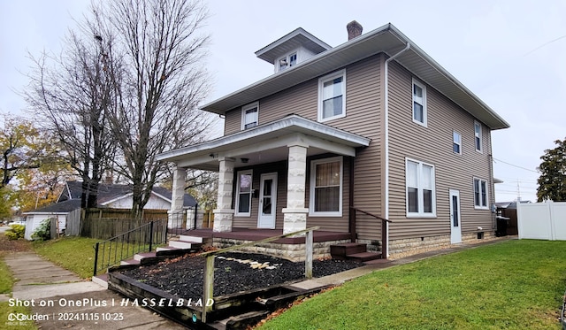 view of front of house featuring a porch and a front lawn