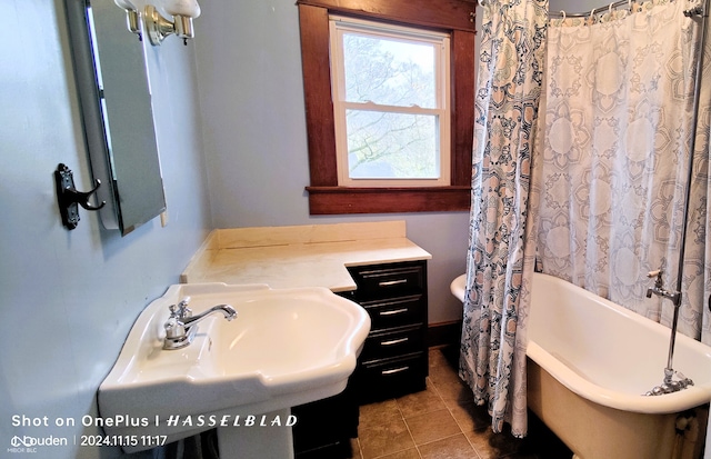 bathroom with tile patterned flooring and sink