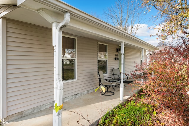 view of exterior entry with covered porch