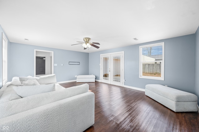 living room featuring ceiling fan, dark hardwood / wood-style flooring, and french doors