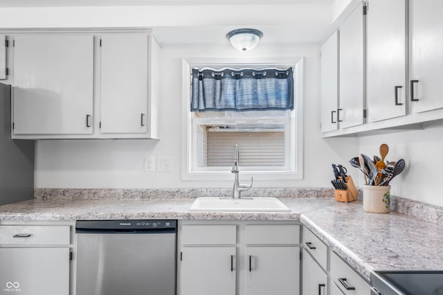 kitchen with sink, white cabinetry, and stainless steel appliances