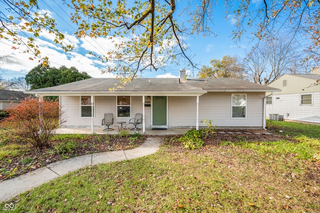 ranch-style house featuring a front yard and central AC