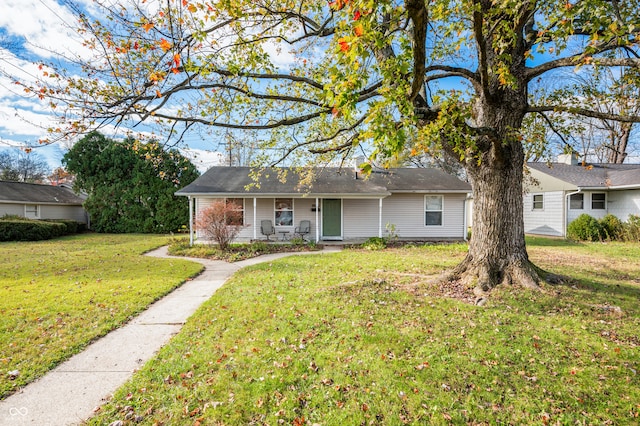 single story home featuring a front yard