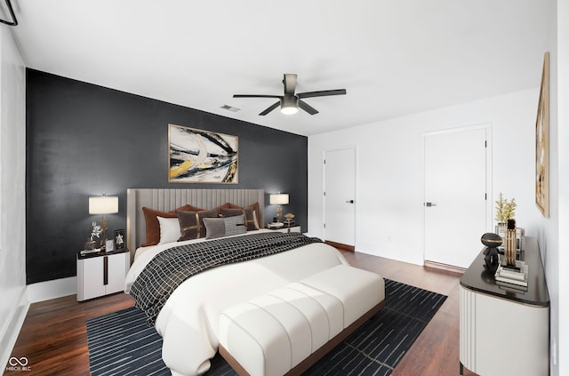 bedroom featuring dark hardwood / wood-style floors and ceiling fan