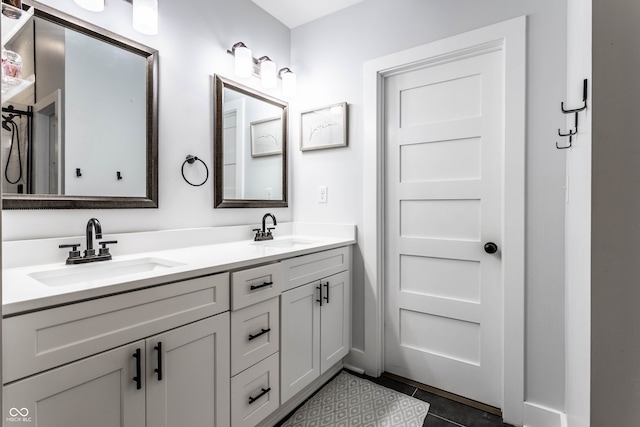 bathroom with vanity and tile patterned floors