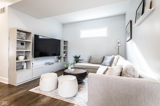 living room with dark hardwood / wood-style floors