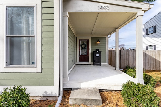 entrance to property featuring a porch