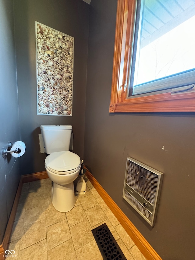 bathroom with tile patterned floors and toilet