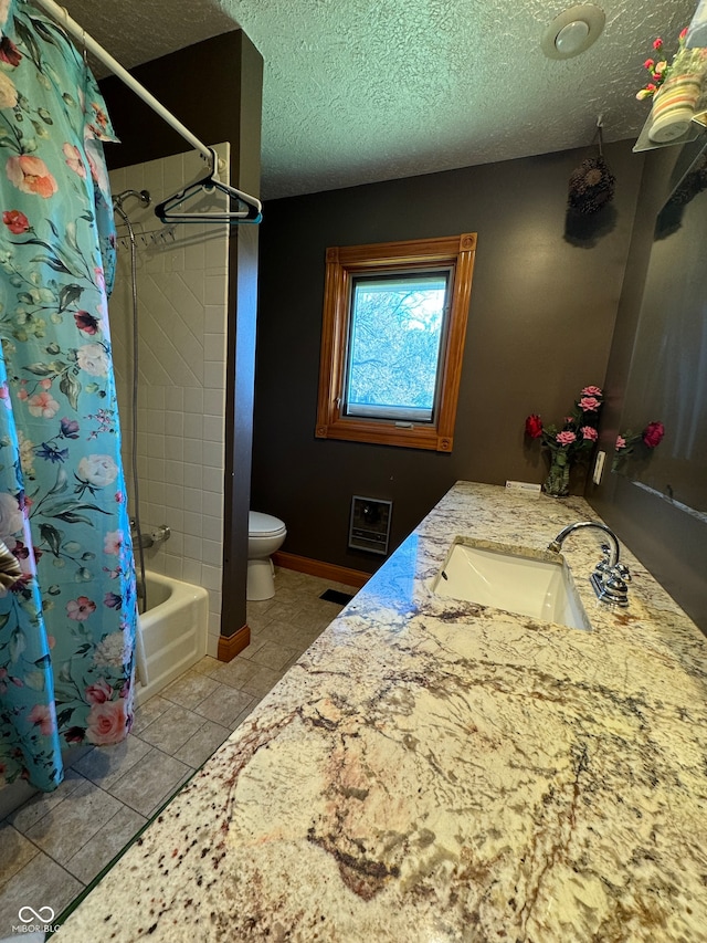 full bathroom with shower / tub combo, a textured ceiling, vanity, tile patterned flooring, and toilet