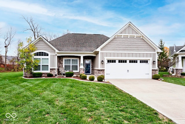 craftsman-style house featuring a garage and a front yard