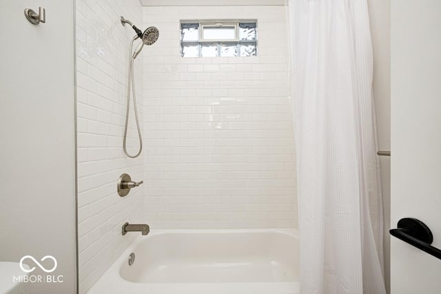 bathroom with shower / bathtub combination with curtain