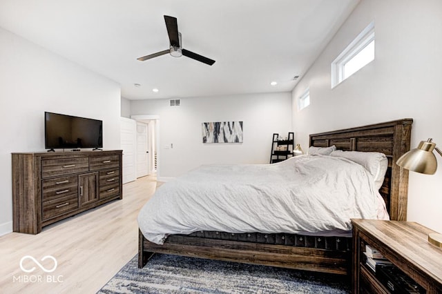 bedroom with light wood-type flooring and ceiling fan