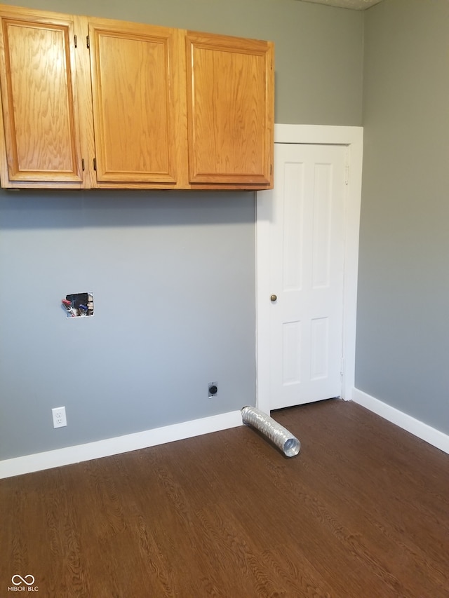 washroom with cabinets and dark wood-type flooring