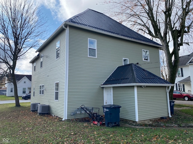 back of property featuring central AC unit