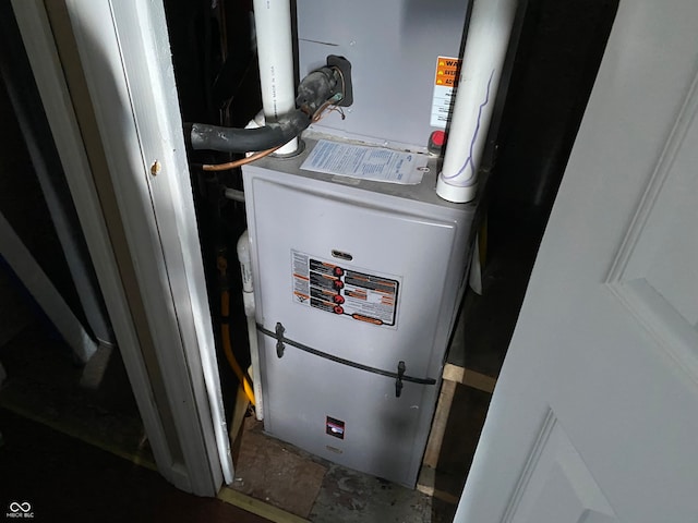 utility room with heating unit