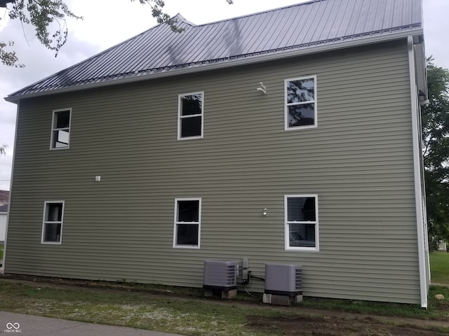 view of property exterior with cooling unit