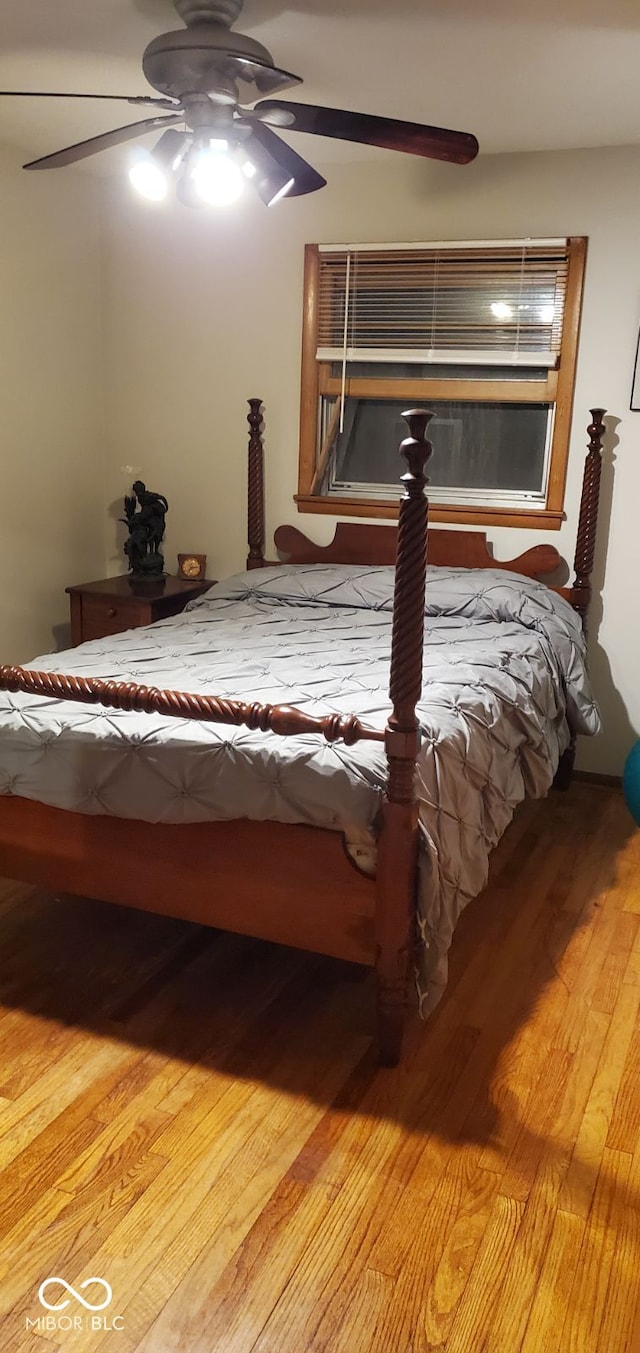 unfurnished bedroom with hardwood / wood-style floors and ceiling fan