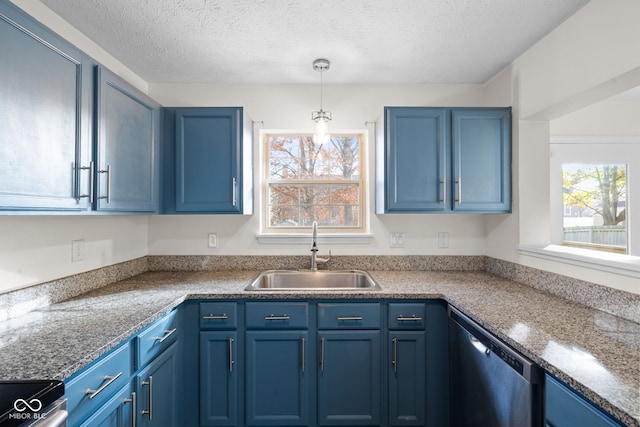 kitchen with blue cabinetry, appliances with stainless steel finishes, plenty of natural light, and sink