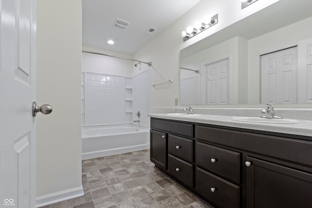 bathroom featuring vanity and shower / washtub combination