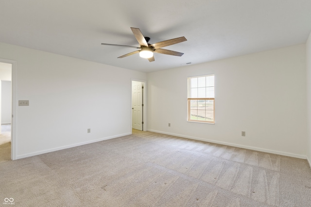 empty room with light carpet and ceiling fan