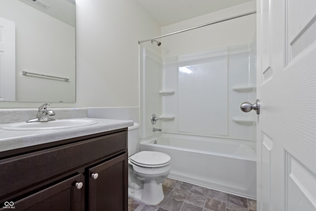 full bathroom featuring shower / bathing tub combination, vanity, and toilet