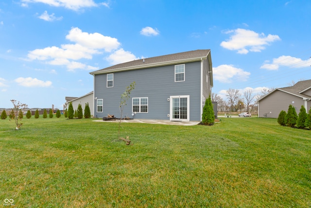 rear view of house with a patio area and a yard