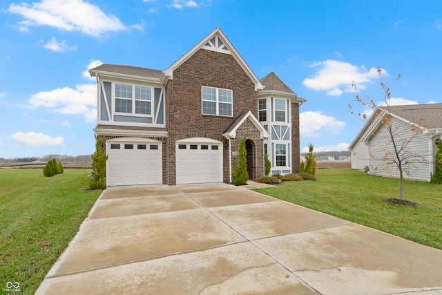 view of front of house with a garage and a front lawn