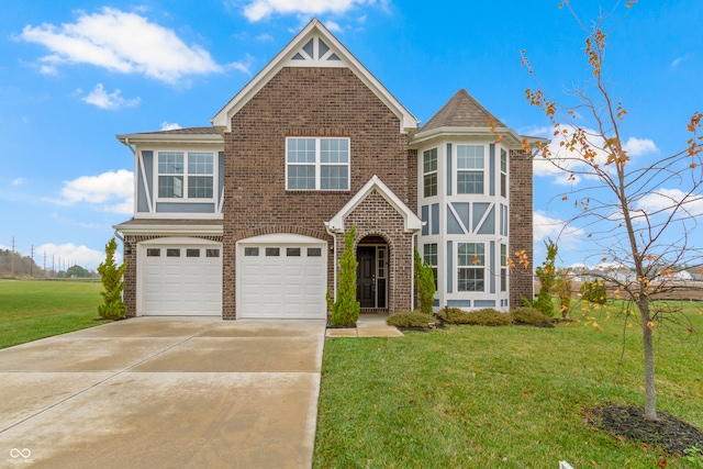 view of front of property with a garage and a front lawn