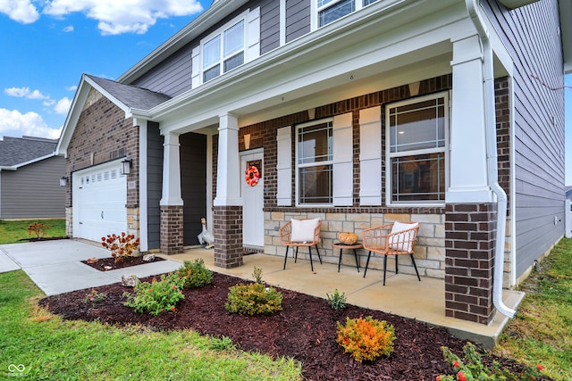 view of front of home with a porch and a garage