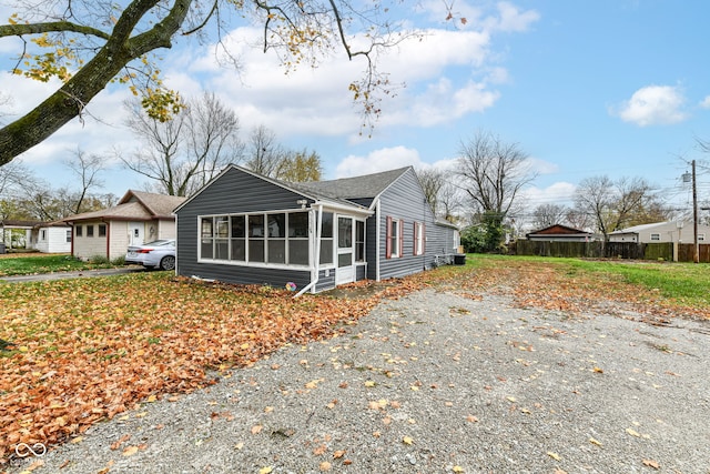 view of side of home with a sunroom