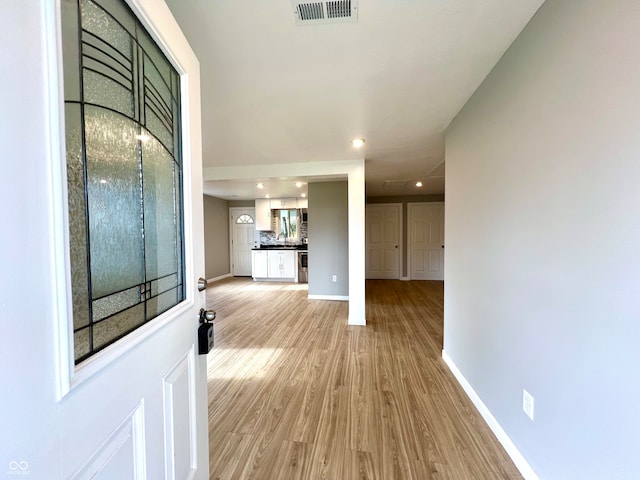 entrance foyer with light hardwood / wood-style floors