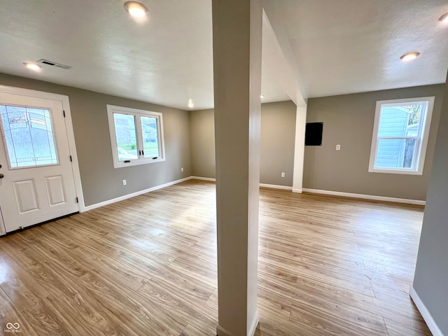 entryway with light hardwood / wood-style floors