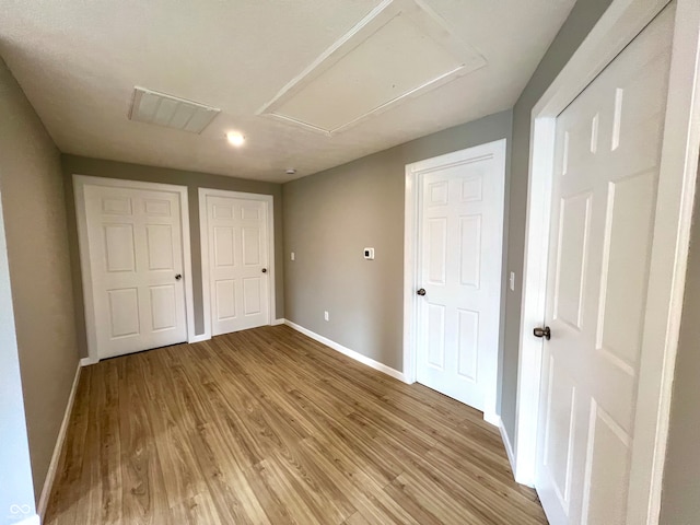 unfurnished bedroom with light hardwood / wood-style flooring