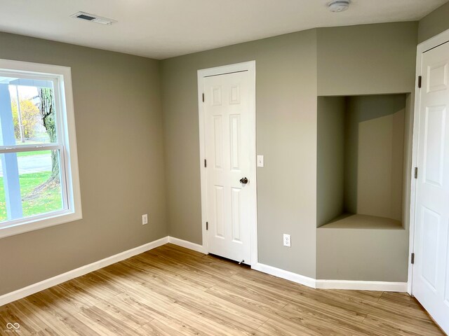 unfurnished bedroom with light hardwood / wood-style floors