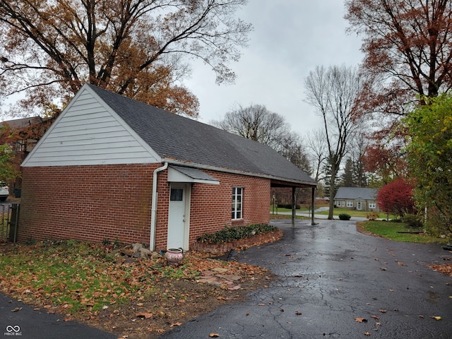 view of side of property featuring a carport