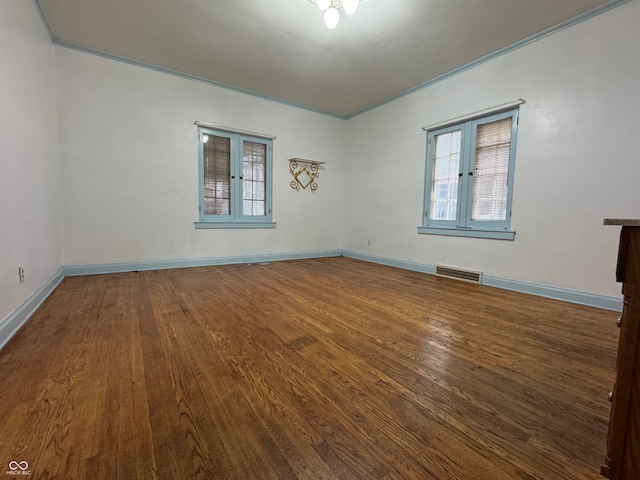 unfurnished room featuring crown molding, french doors, and wood-type flooring