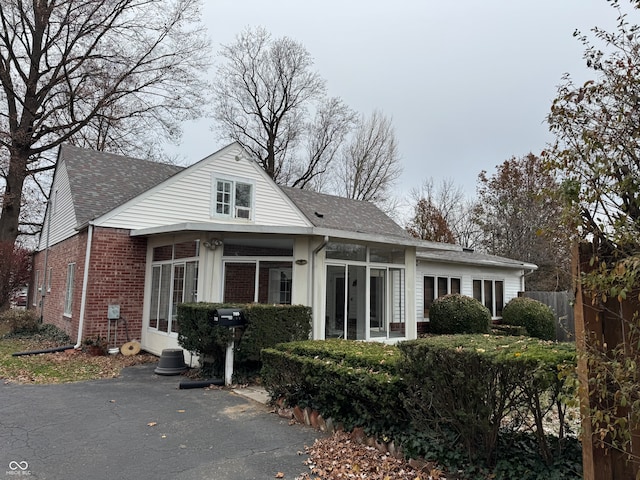 view of front of house featuring a sunroom