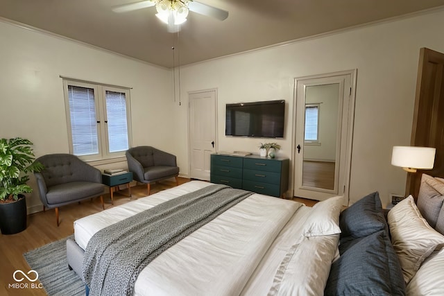 705 W 6th St, Seymour, IN 47274 - bedroom with wood finished floors, ceiling fan, and french doors