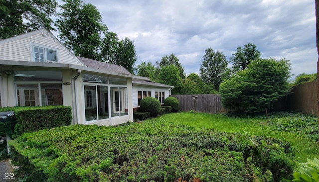 705 W 6th St, Seymour, IN 47274 - fenced backyard featuring a sunroom