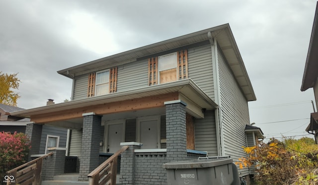 view of property featuring a porch