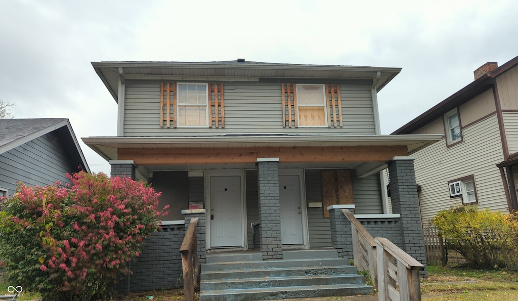 view of front property featuring covered porch